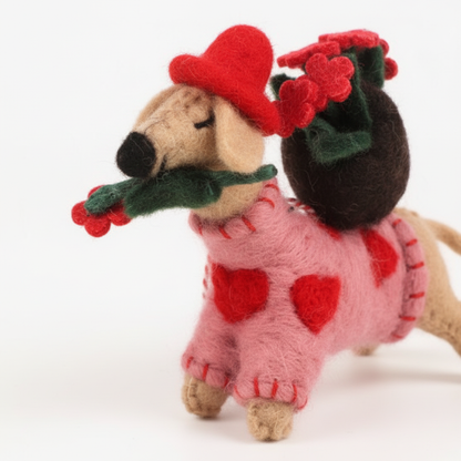 Close-up detail of handmade wool felt rose pup showing sweetheart design and artisan craftsmanship
