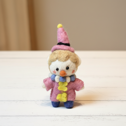 Front view of handmade Nepalese wool felt pastel circus clown charm
