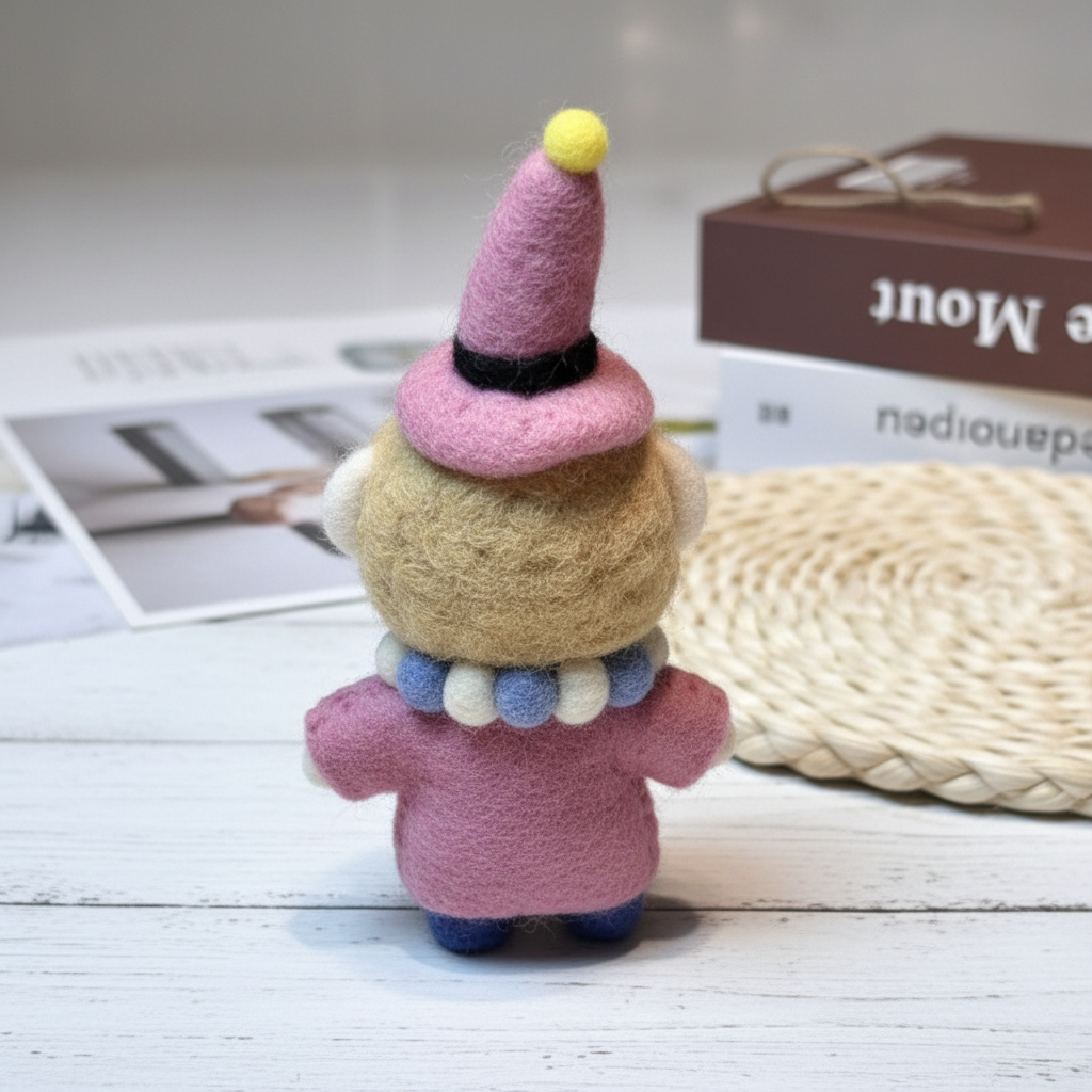 Back view of handmade wool felt clown charm showing felt construction
