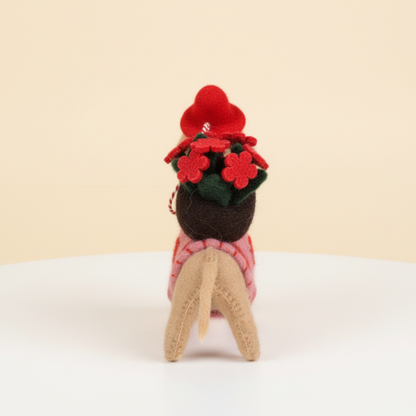 Back view of handmade wool felt rose dog charm showing felt construction
